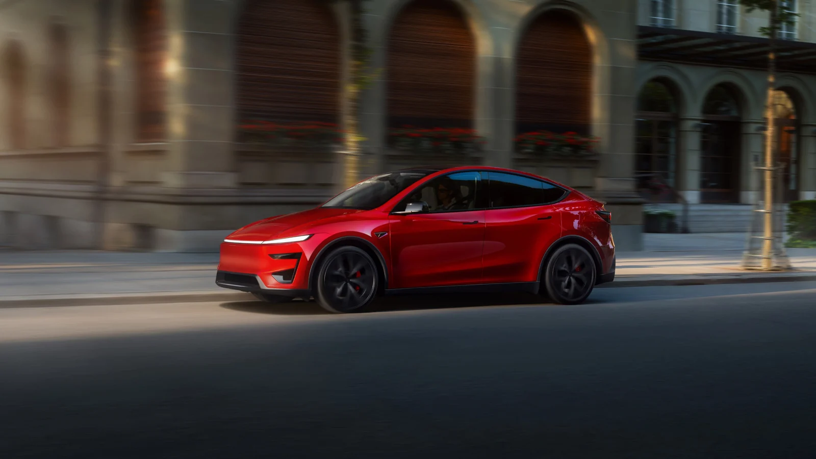 Tesla Model Y exterior side view in red